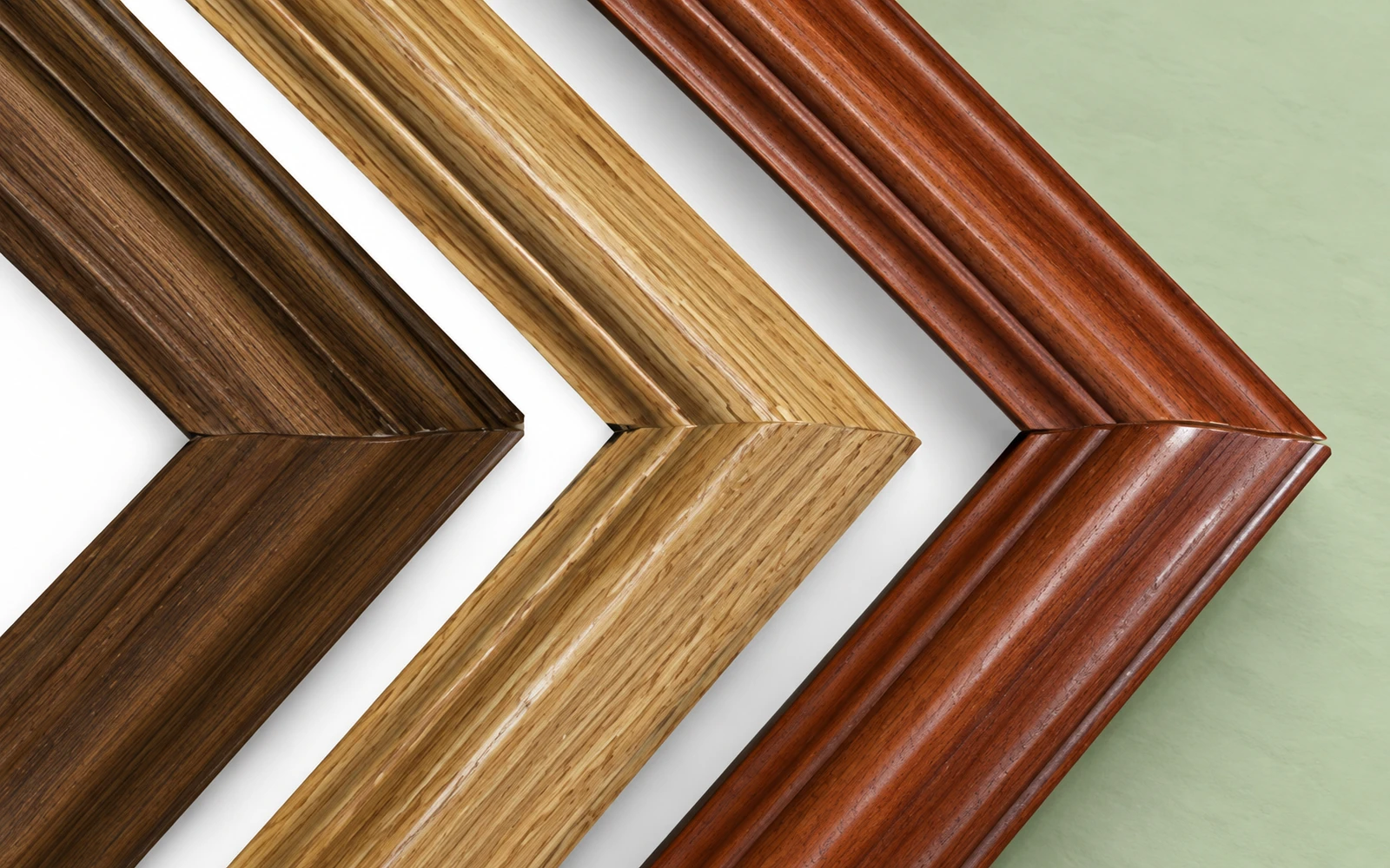 Dark oak, light oak and cherry frame corners side by side