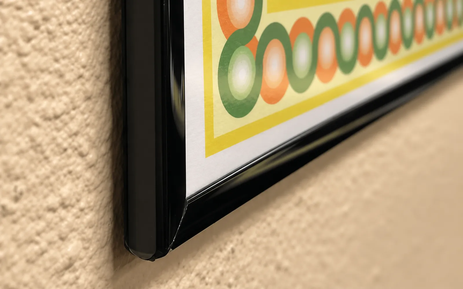 The corner of a mounted map finished with a slim black edge