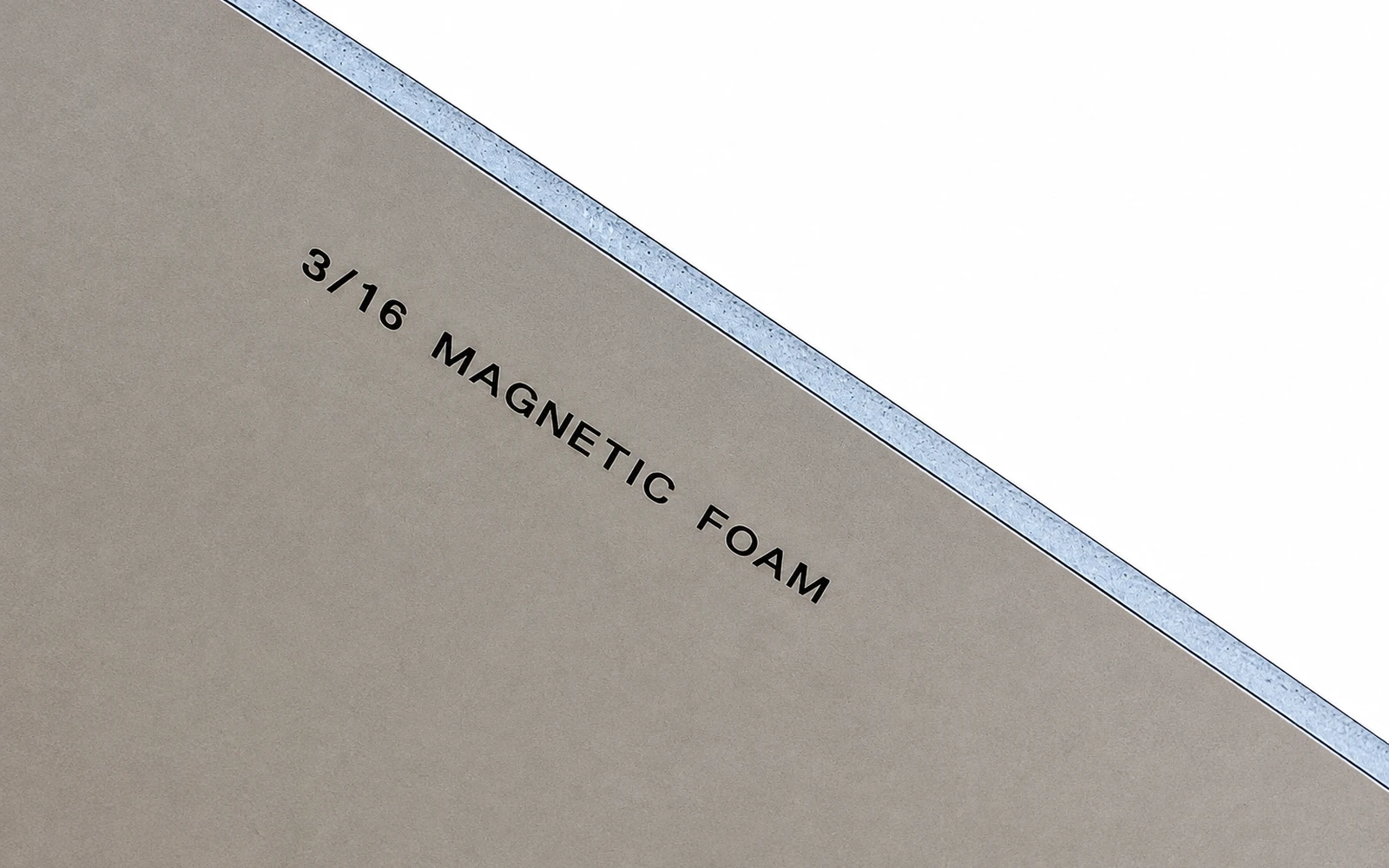 The cut corner of a board printed 3/16 MAGNETIC FOAM