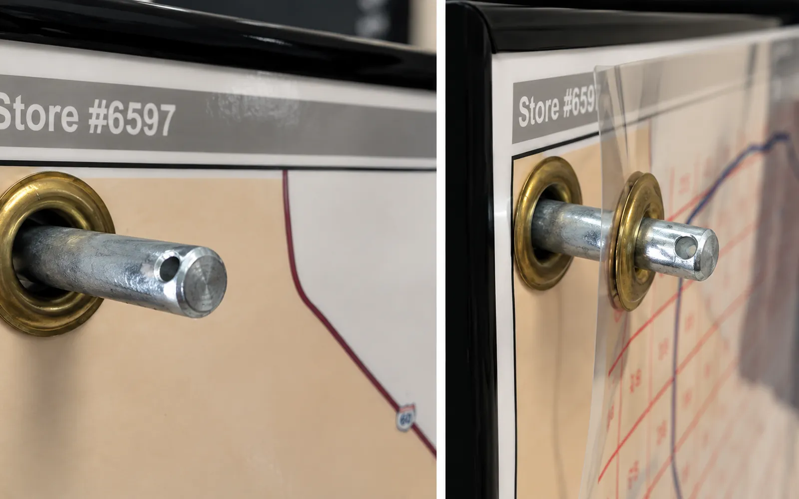 A steel peg through a brass grommet in a framed map, then a clear overlay hung on it