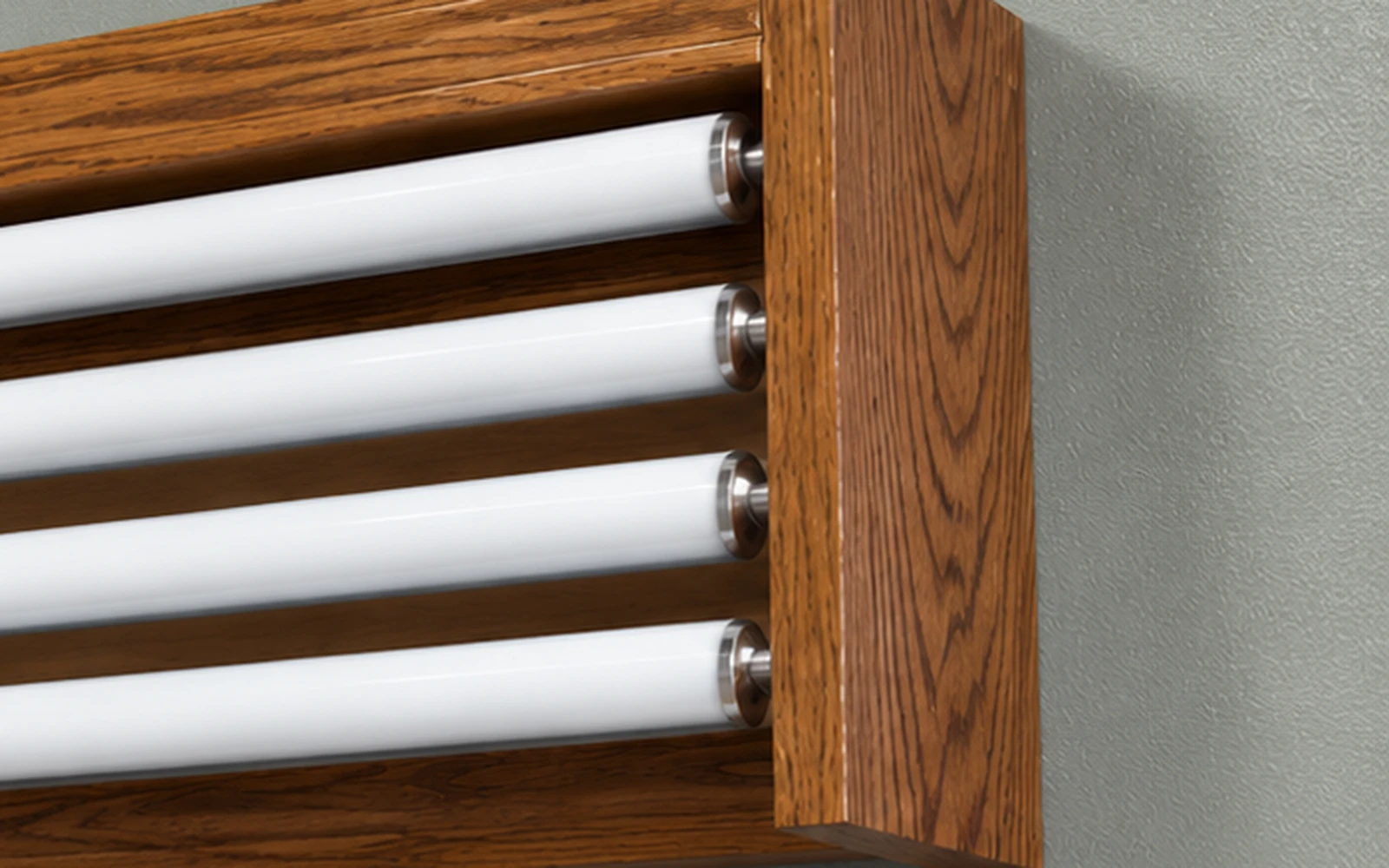Close-up of four roller ends inside a wooden valance