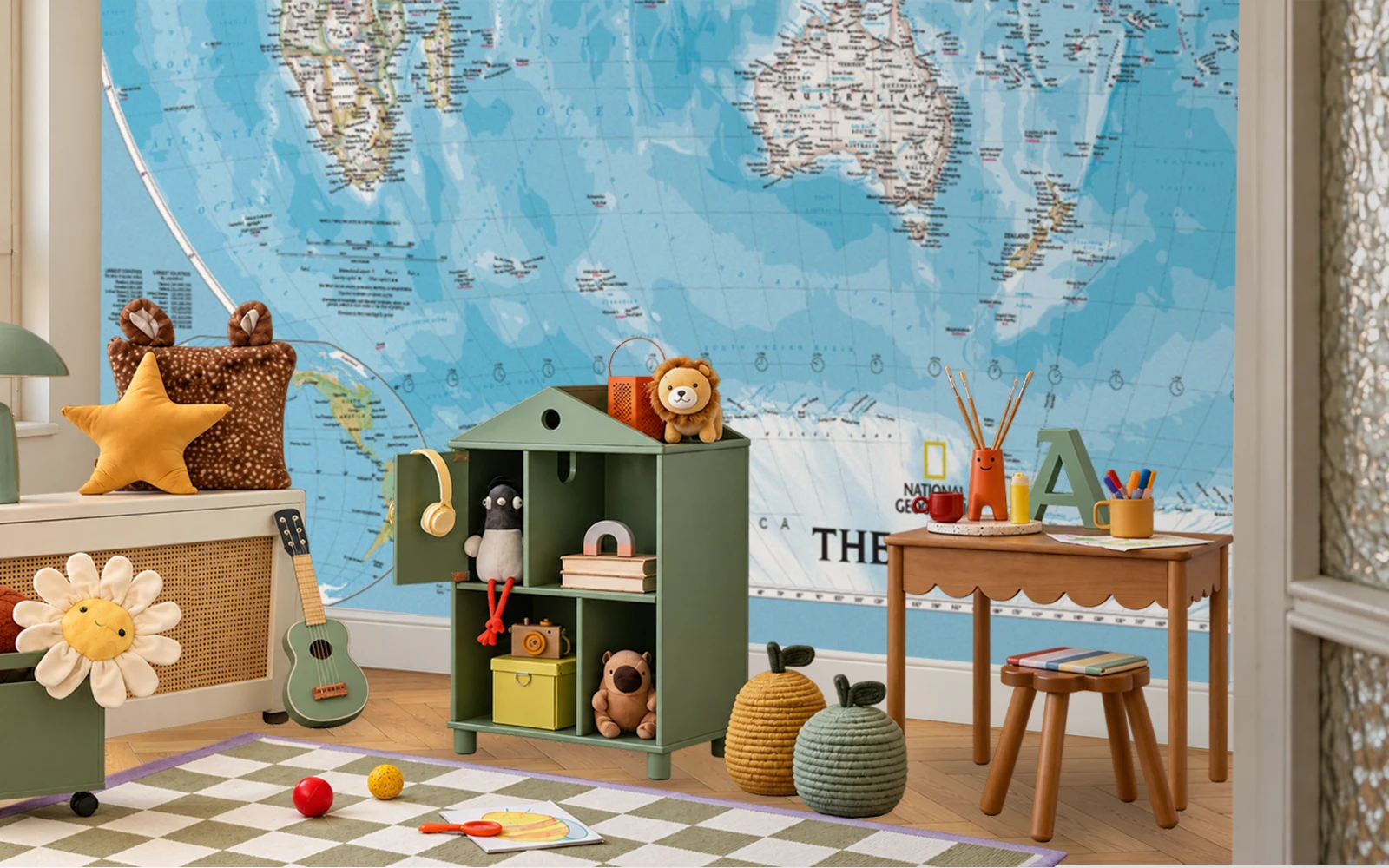A playroom with a world map hung as wallpaper